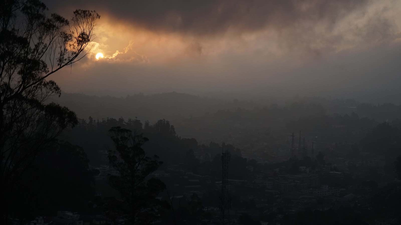 The sunset from outside the team museum was beautiful and the fog gave it a cool mystic feel. My autorickshaw driver showed me some photos he took around Ooty and I discovered that he was pretty into photography, he was a middle aged Indian (or possibly Arabic) man and he could only take photos on his small flip phone but they were really good! After the sunset he took me around some more scenic spots in Ooty before dropping me back off. It was like a private photo tour. He would stop just long enough at each place so I could take a photo and then we kept going. Unfortunately the views were mostly covered in fog but that was still super cool of him to give me a private little photo tour (he didn't ask for more money or anything like that for it).