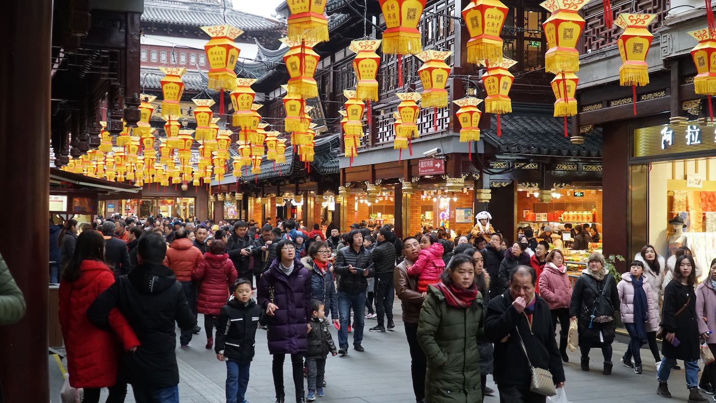 Ah okay here's where everybody was hiding. I found a crowded part of town, filled with old Chinese architecture and decorated for the festivities.