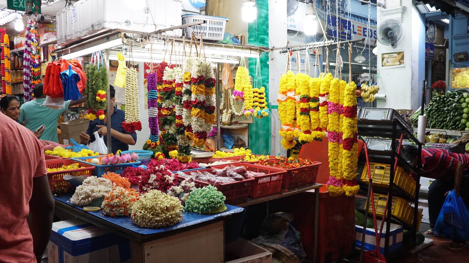 Tons of street vendors selling flowers all day and night in Little India. I'd walk past at least 5 of these stands on my way back home.